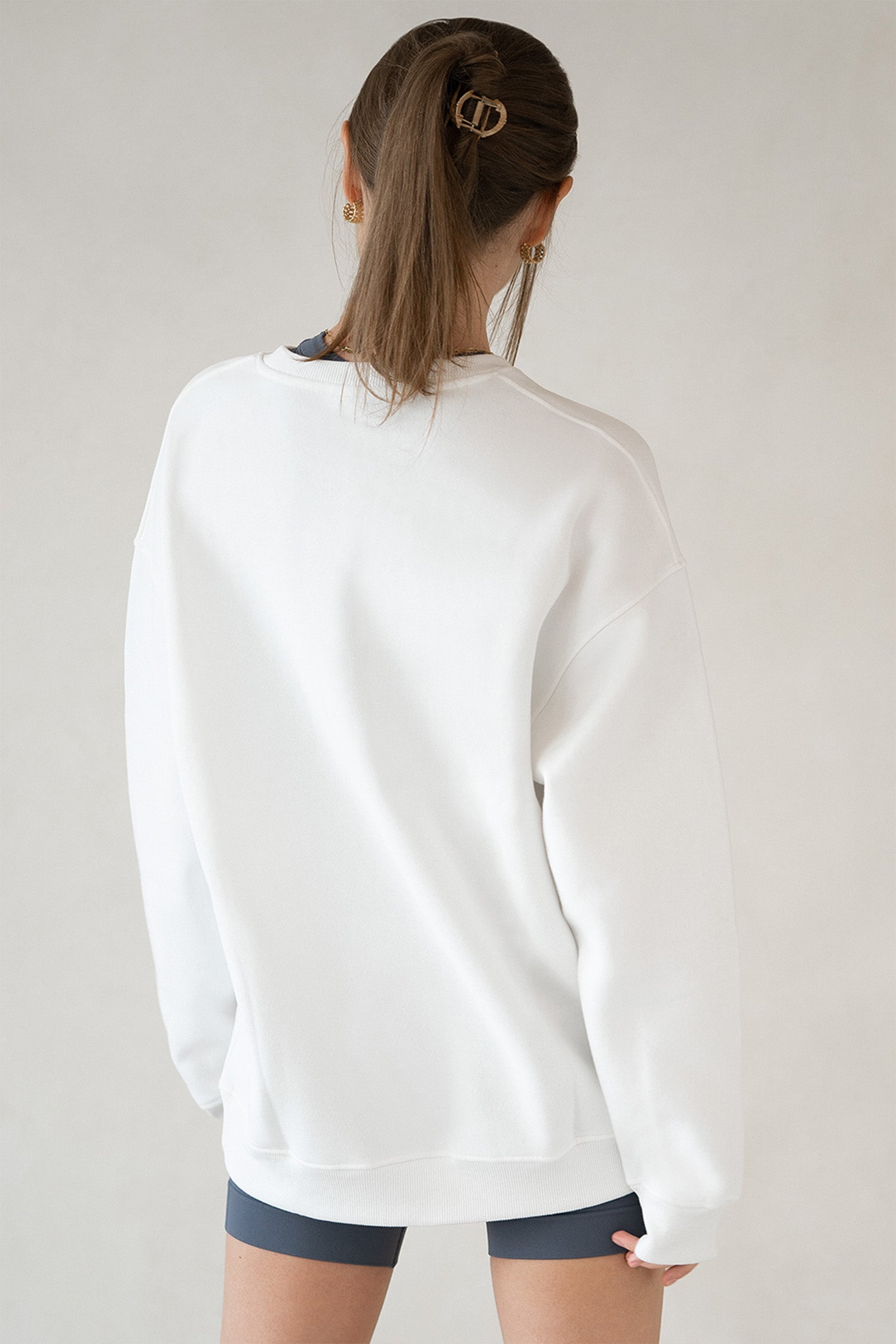 Back view of Layover Pullover showing full oversized design in clean white cotton