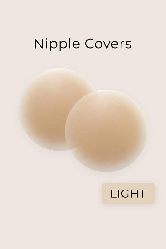 Light nude silicone nipple covers by Aurelia Raw displayed on a blush soft beige background, labeled as “Light”