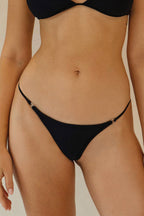 Front close-up of Athens Bikini Bottoms showing the sleek, V-cut style and metal details