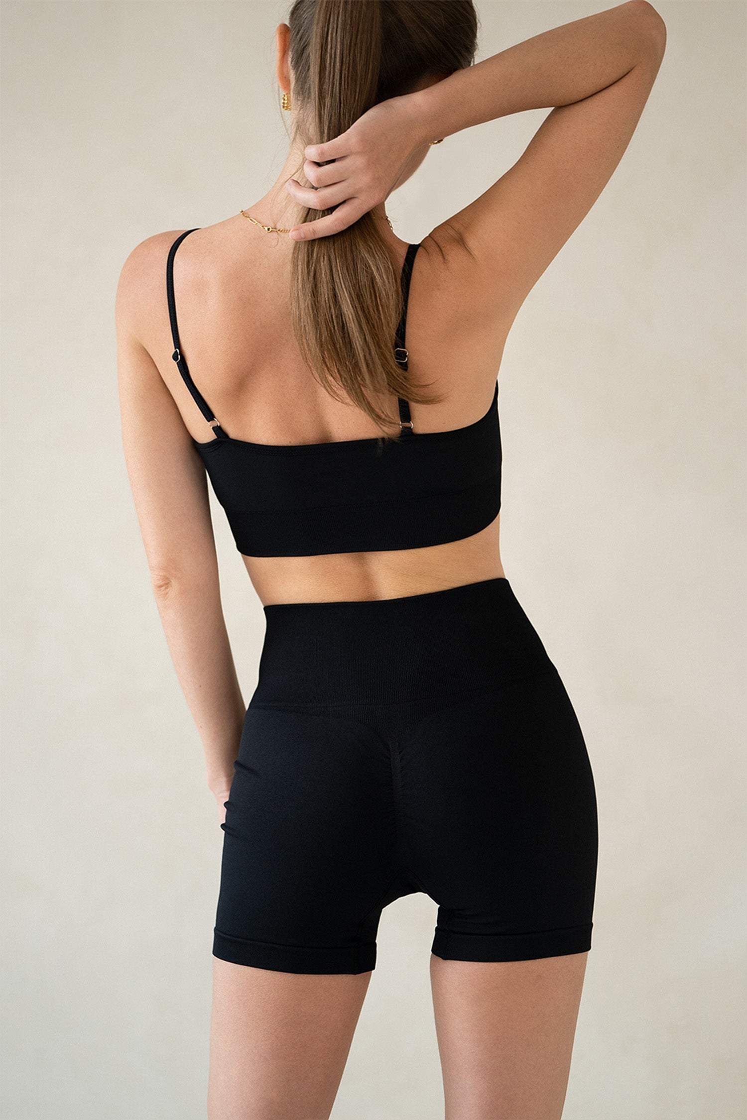 Back view of Aurelia Raw Horizon workout set highlighting racerback detail and seamless fit