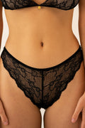 Close-up of Le Petit lace panties from Aurelia Raw with floral lace pattern and scalloped edges