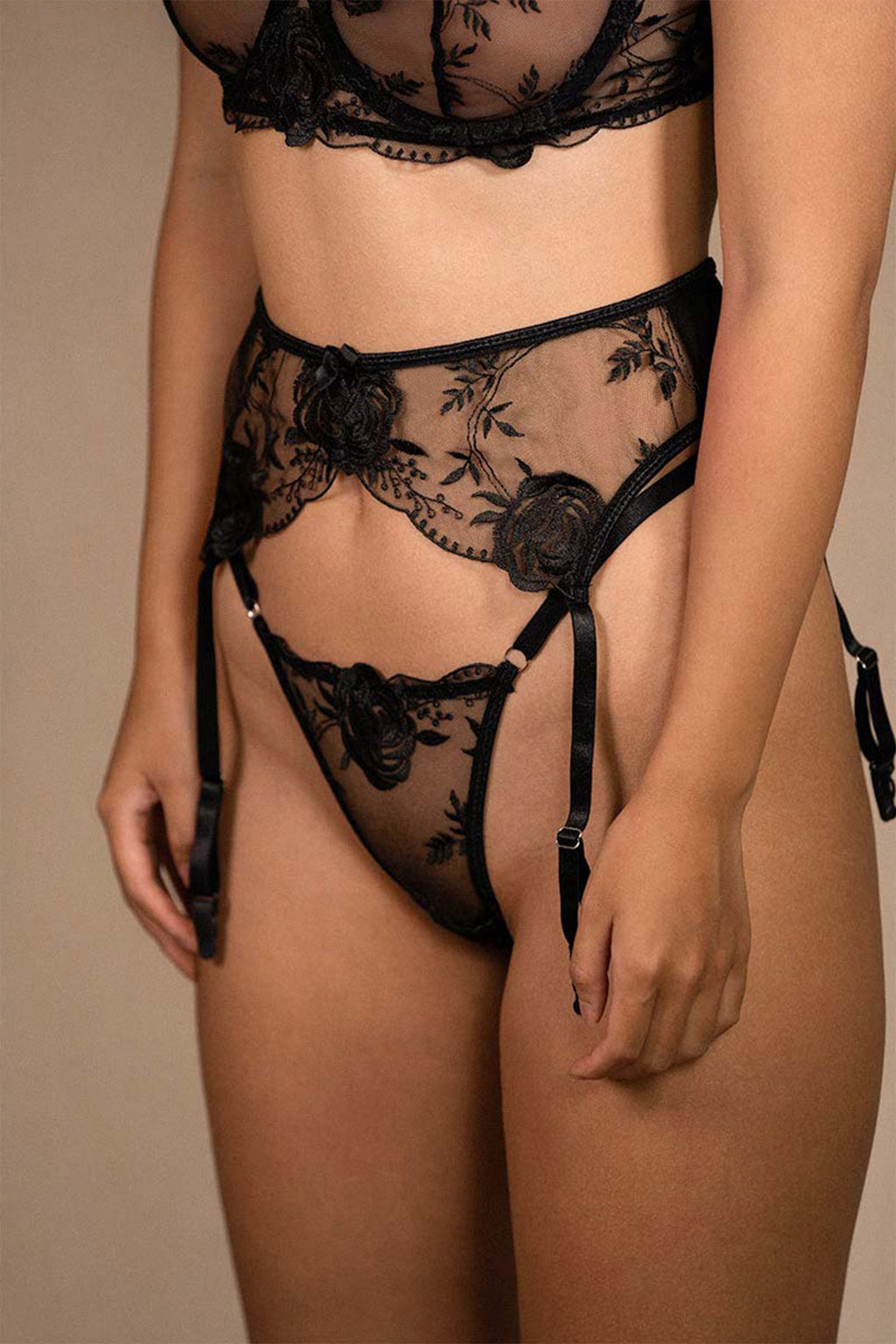 Side close-up of Aurelia Raw Venice intimates set, highlighting sheer floral lace detailing on garter and thong